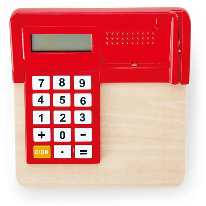 Calculadora de juguete roja con botones blancos y pantalla digital en Tienda Pop-Up Hape